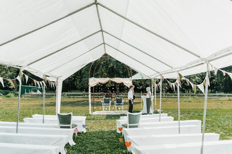 An outdoor tented wedding celebration