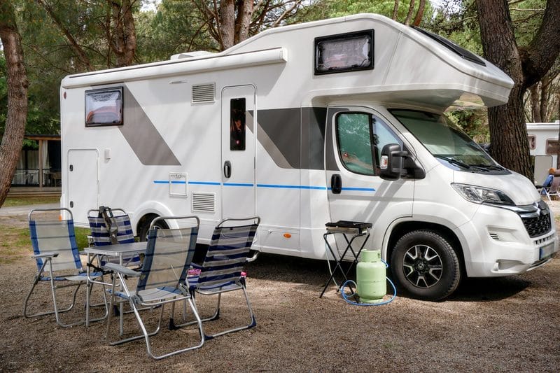 A motorhome set up at a campsite